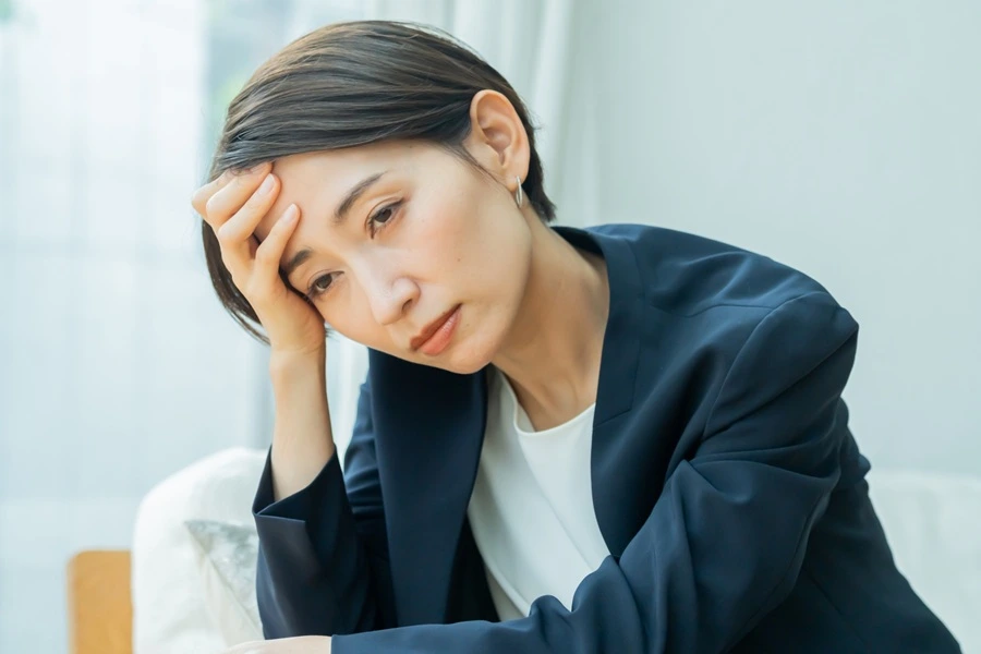 体調不良の女性